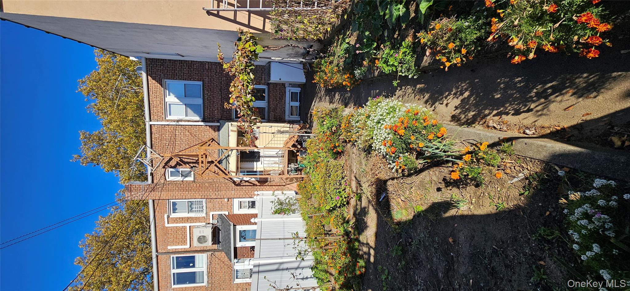 78-54 75th Street Queens, NY 11385 - Photo 30 of 31 Rear view of house with brick siding