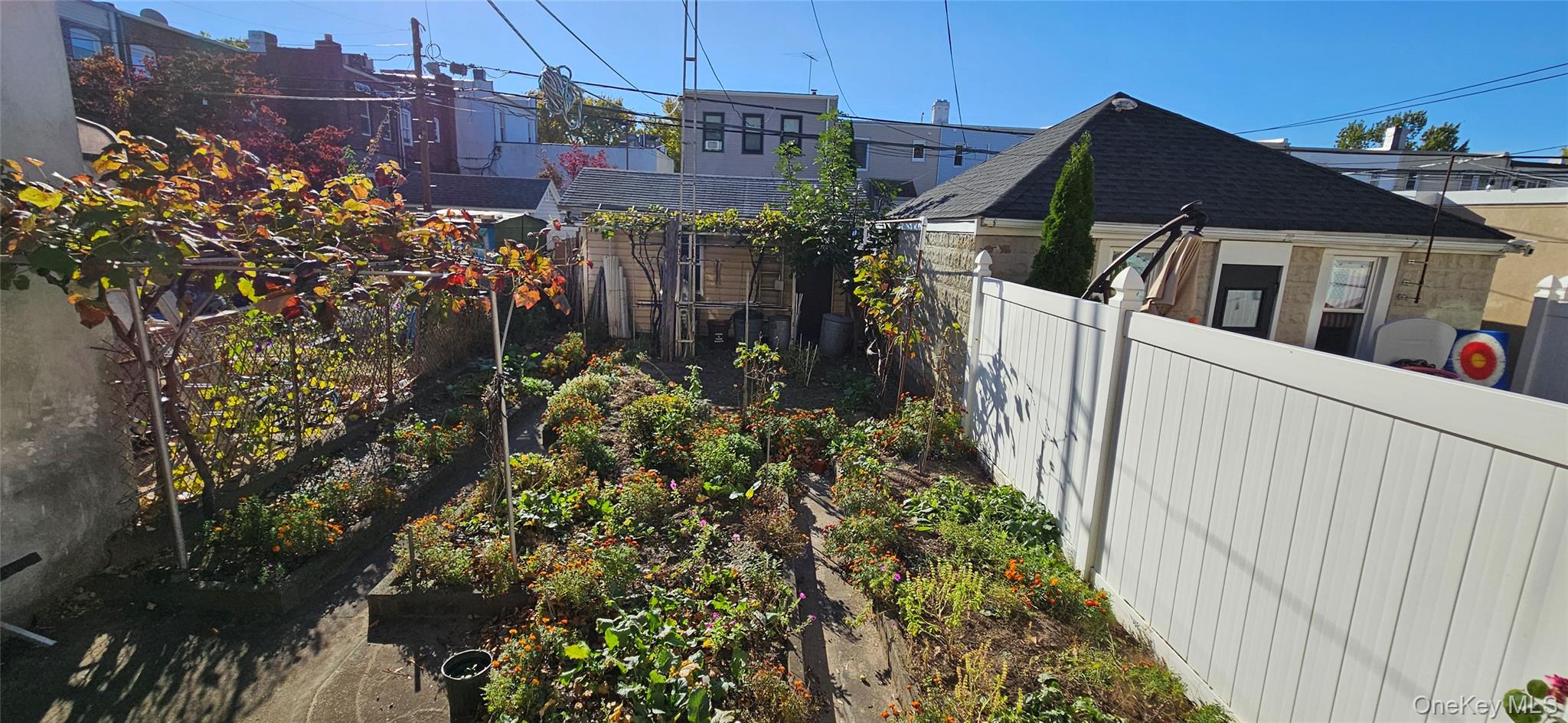78-54 75th Street Queens, NY 11385 - Photo 31 of 31 View of home's exterior featuring a shingled roof