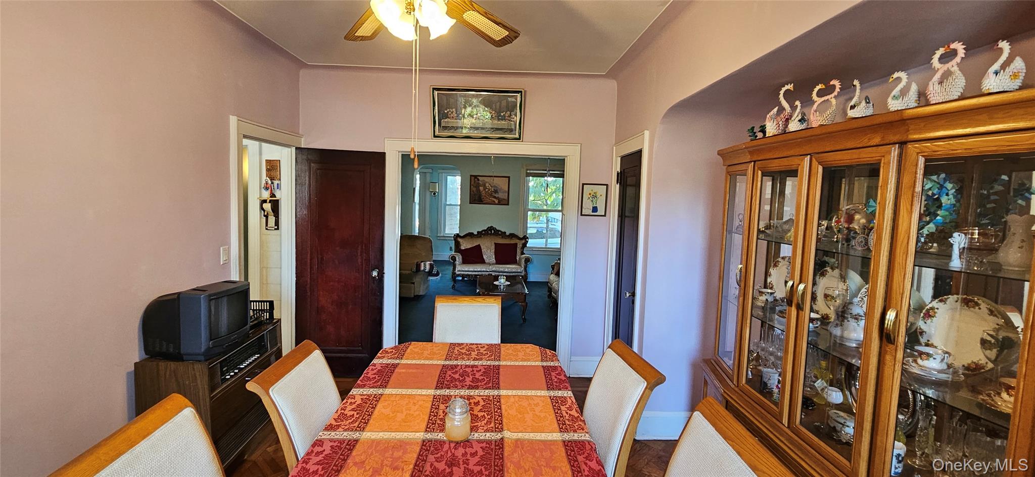 78-54 75th Street Queens, NY 11385 - Photo 6 of 31 Dining room featuring a ceiling fan and baseboards