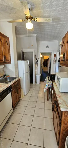 a white toilet sitting next to a bathroom sink