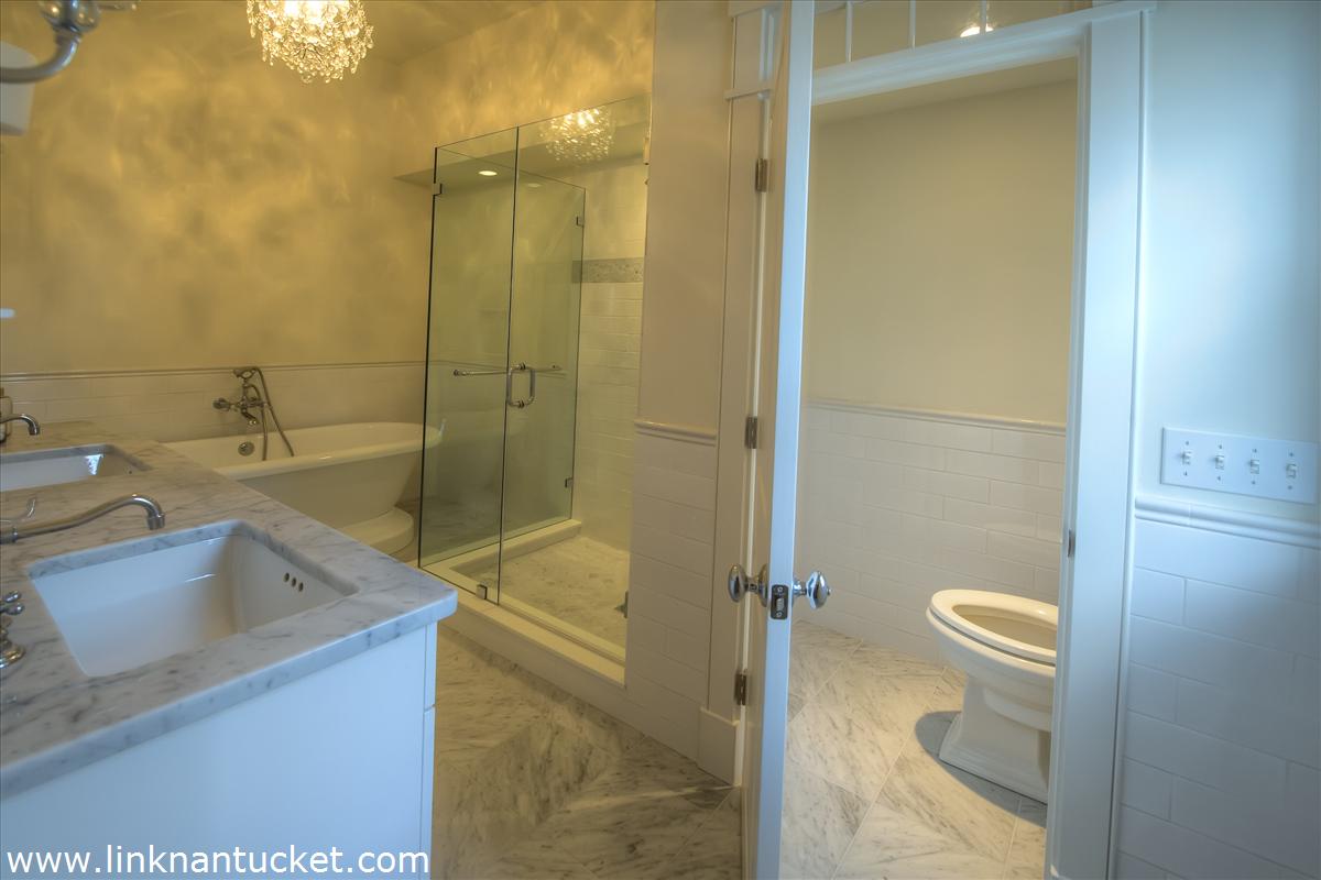 4 Beaver Street Nantucket, MA 02554 - Photo 16 of 19 a bathroom with a sink a toilet and shower