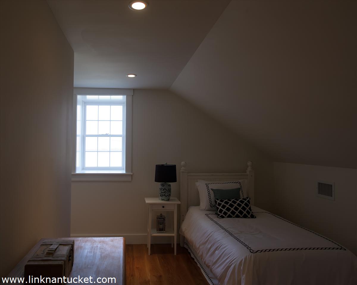 4 Beaver Street Nantucket, MA 02554 - Photo 18 of 19 a bedroom with a bed and a window