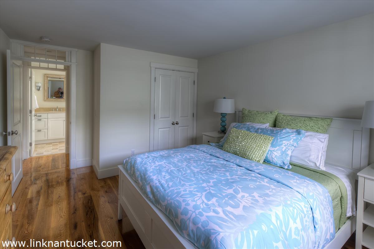 4 Beaver Street Nantucket, MA 02554 - Photo 19 of 19 a bedroom with a bed and wooden floor
