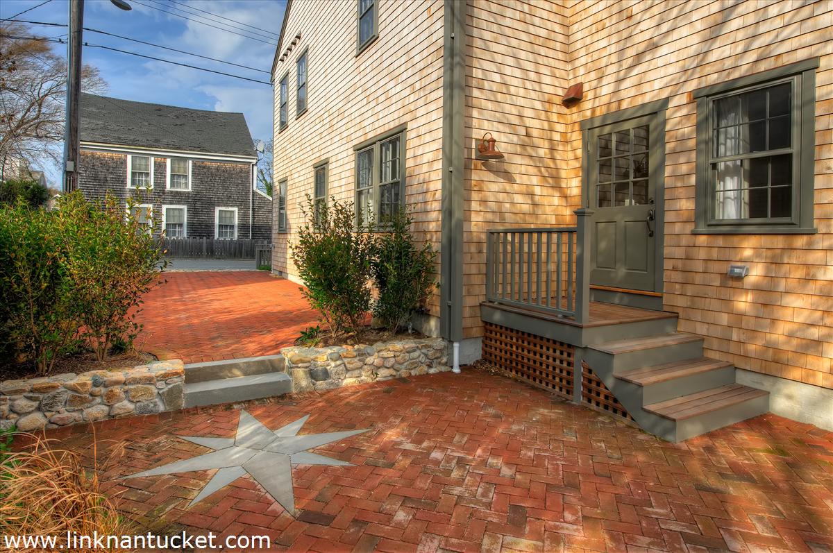 4 Beaver Street Nantucket, MA 02554 - Photo 3 of 19 a view of a porch with a bench