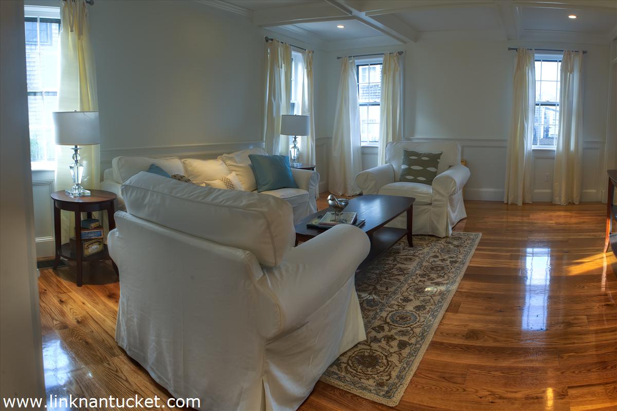 4 Beaver Street Nantucket, MA 02554 - Photo 7 of 19 a living room with furniture and a fireplace