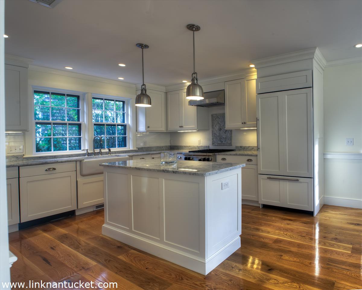 4 Beaver Street Nantucket, MA 02554 - Photo 10 of 19 a kitchen with stainless steel appliances granite countertop a sink a stove a refrigerator and island with wooden floor