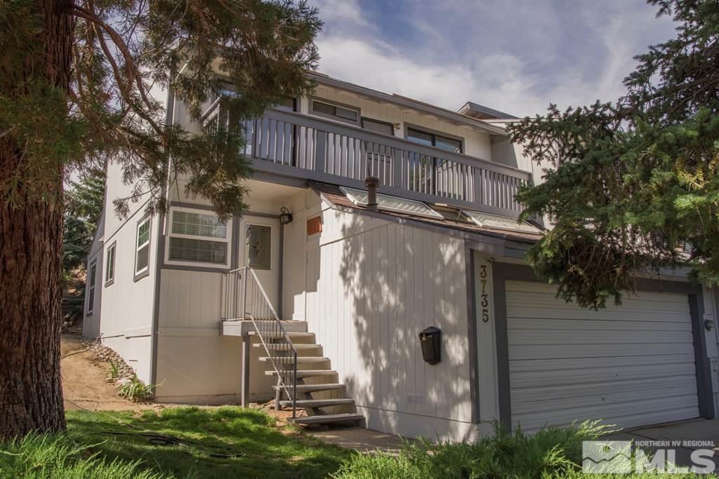 3735 Christopher Circle Reno, NV 89503 - Photo 1 of 19 a view of a house with a yard