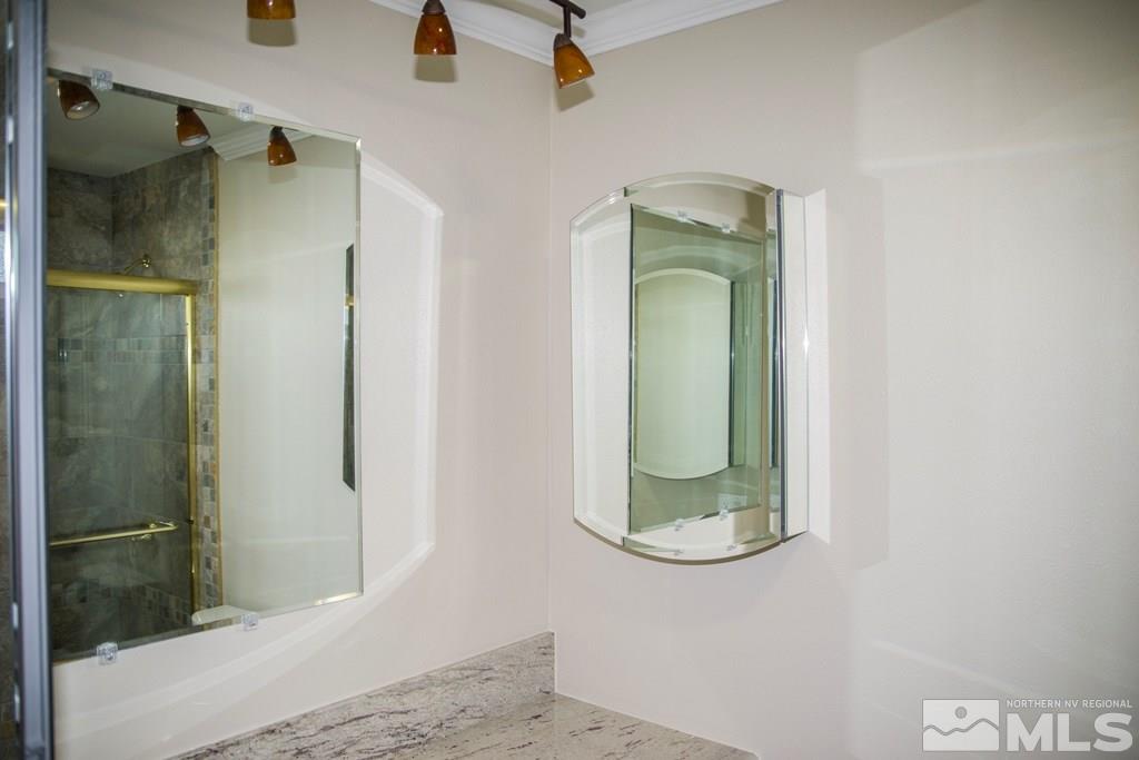 3735 Christopher Circle Reno, NV 89503 - Photo 13 of 19 a bathroom with a mirror and a shower
