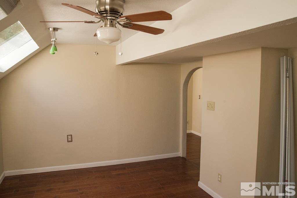 3735 Christopher Circle Reno, NV 89503 - Photo 16 of 19 an empty room with wooden floor and fan