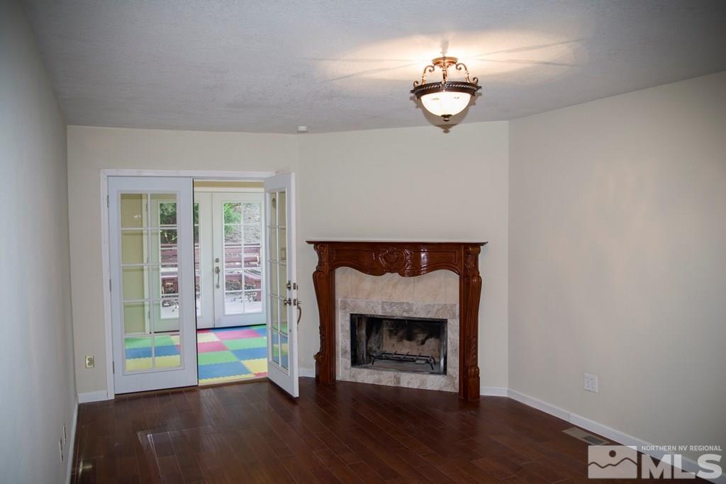 3735 Christopher Circle Reno, NV 89503 - Photo 6 of 19 a room with a fireplace and a fireplace