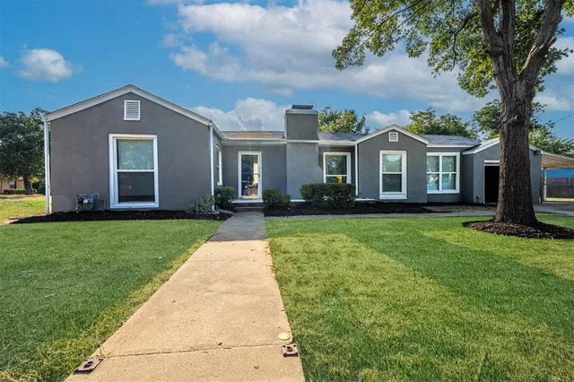 front view of a house with a yard