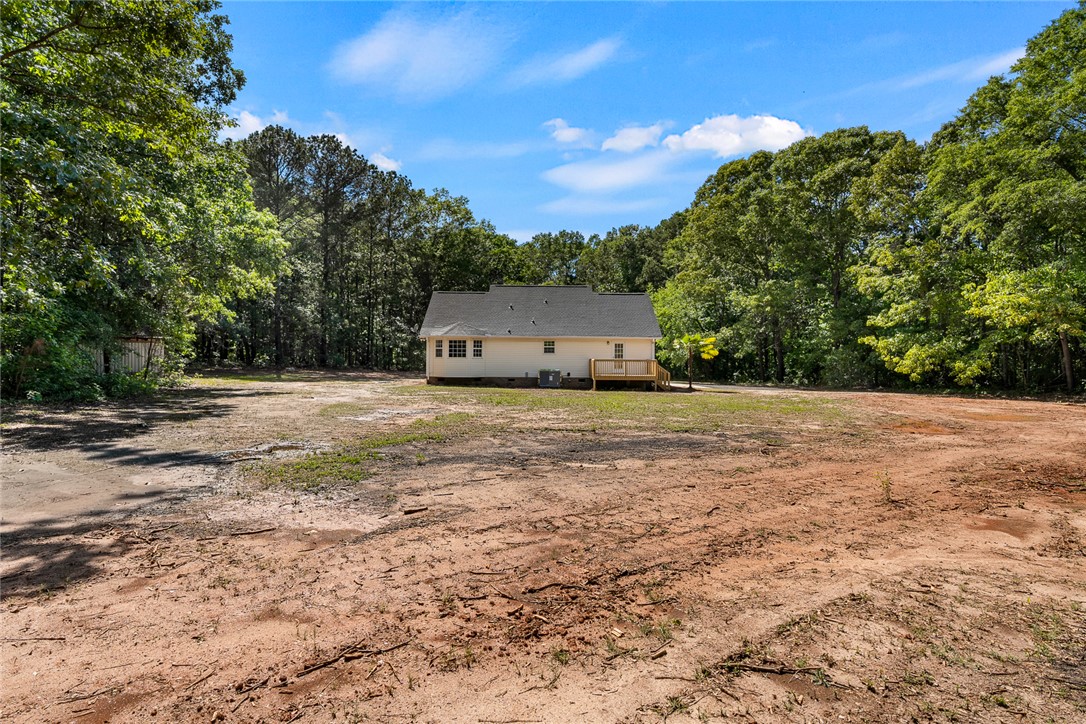 131 Lockaby Road Pelzer, SC 29669 - Photo 40 of 50 A quaint residence nestled amidst verdant trees, offering tranquil outdoor living.