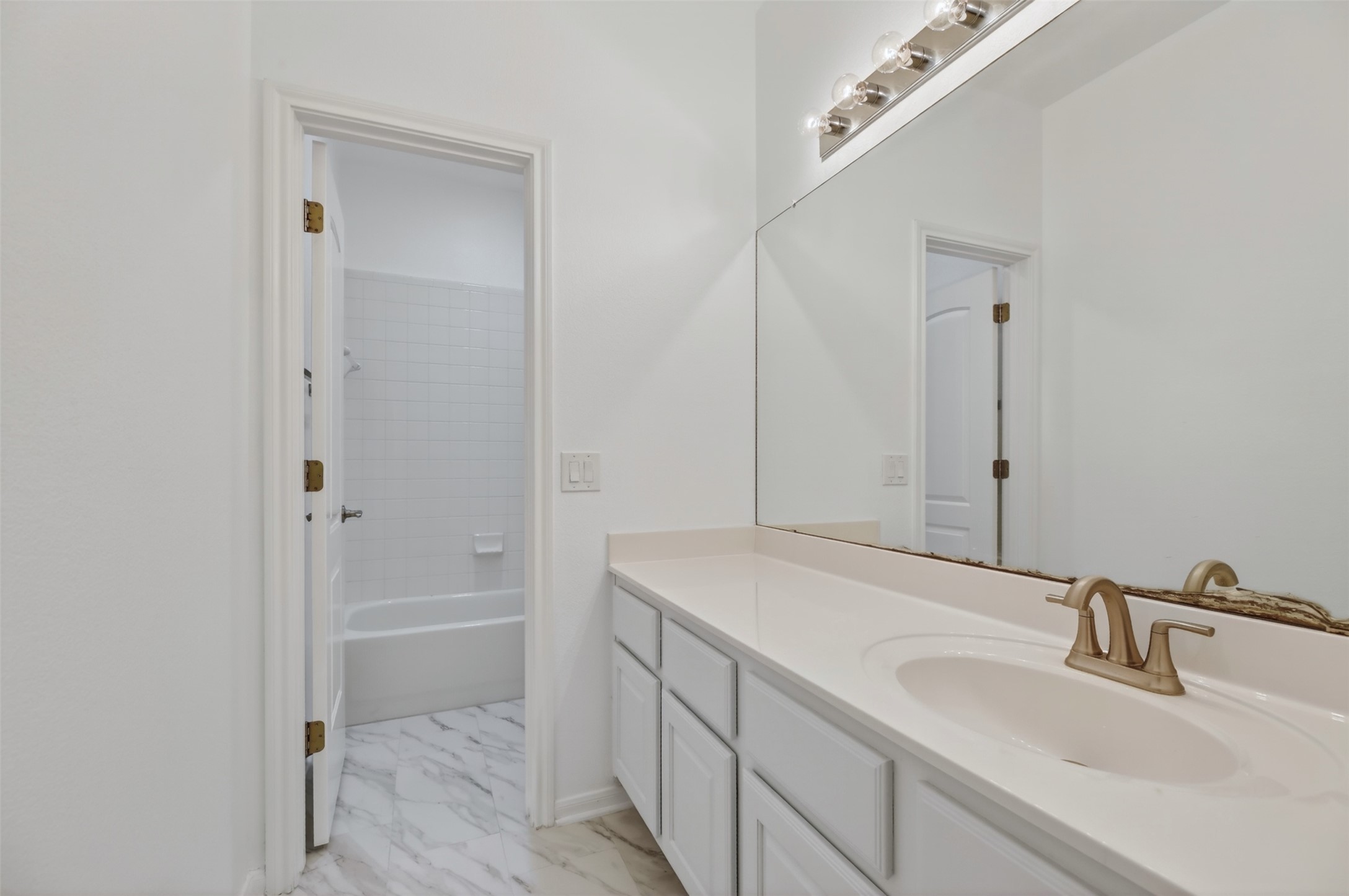 545 Manchester Lane Austin, TX 78737 - Photo 20 of 30 a bathroom with a sink and a mirror