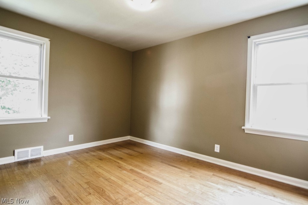 3415 Birchdale Road Northwest Canton, OH 44708 - Photo 10 of 18 First floor bedroom. New vinyl windows offer lots of natural light. New interior paint. Beautiful hardwood floors.