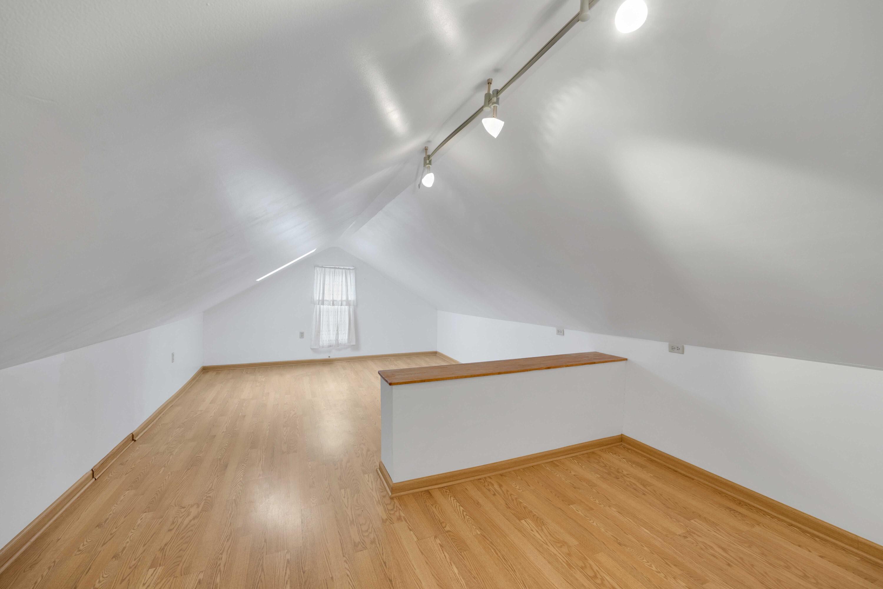643 McKinley Street Gary, IN 46404 - Photo 18 of 22 an empty room with wooden floor and windows
