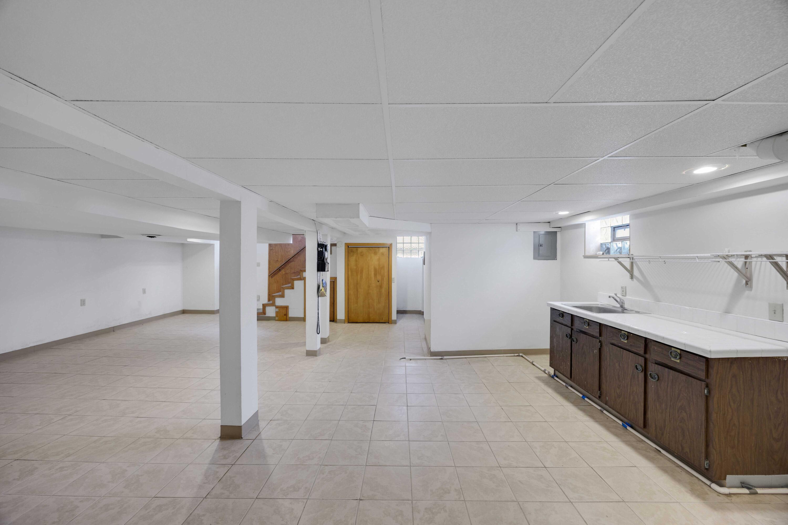 643 McKinley Street Gary, IN 46404 - Photo 19 of 22 a view of a kitchen with a sink and cabinets