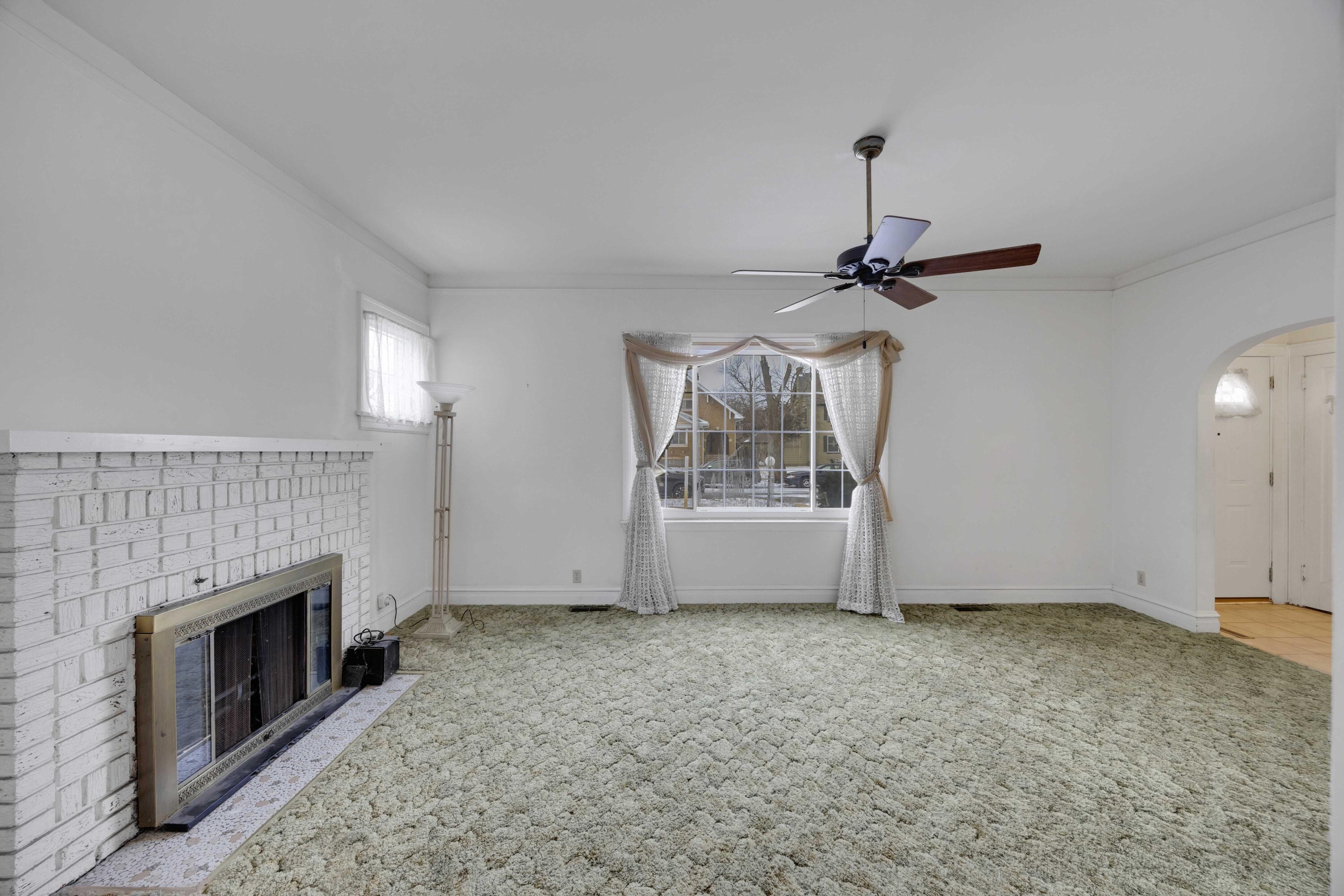 643 McKinley Street Gary, IN 46404 - Photo 3 of 22 a view of an empty room with a fireplace