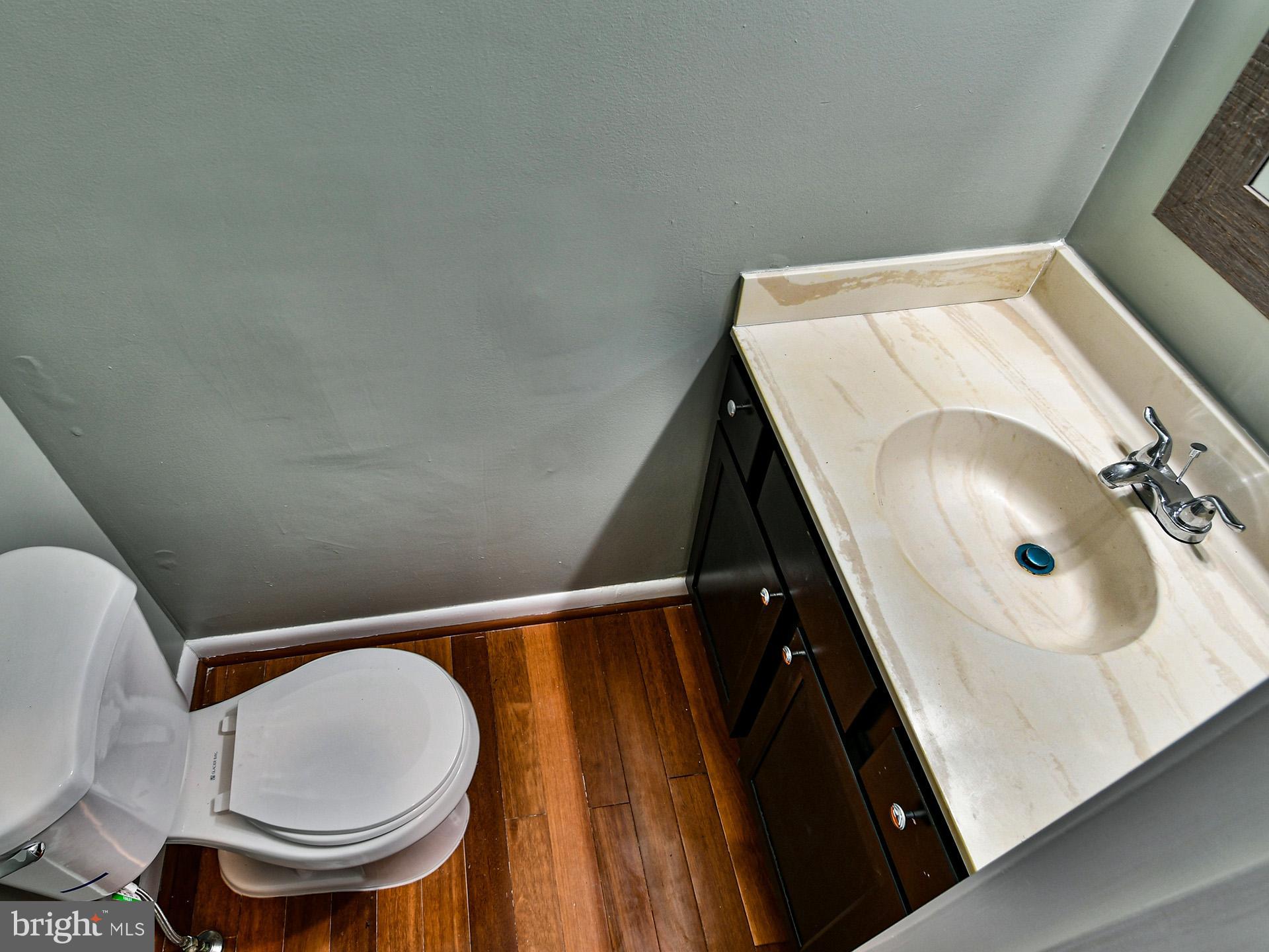 3511 Castle Way, Unit 312 Silver Spring, MD 20904 - Photo 12 of 34 a bathroom with a sink and toilet