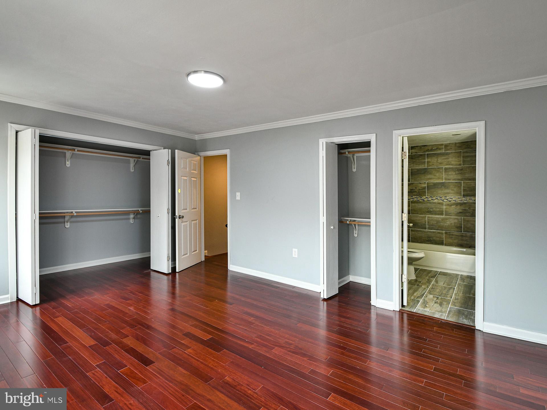 3511 Castle Way, Unit 312 Silver Spring, MD 20904 - Photo 15 of 34 a view of empty room with wooden floor and window