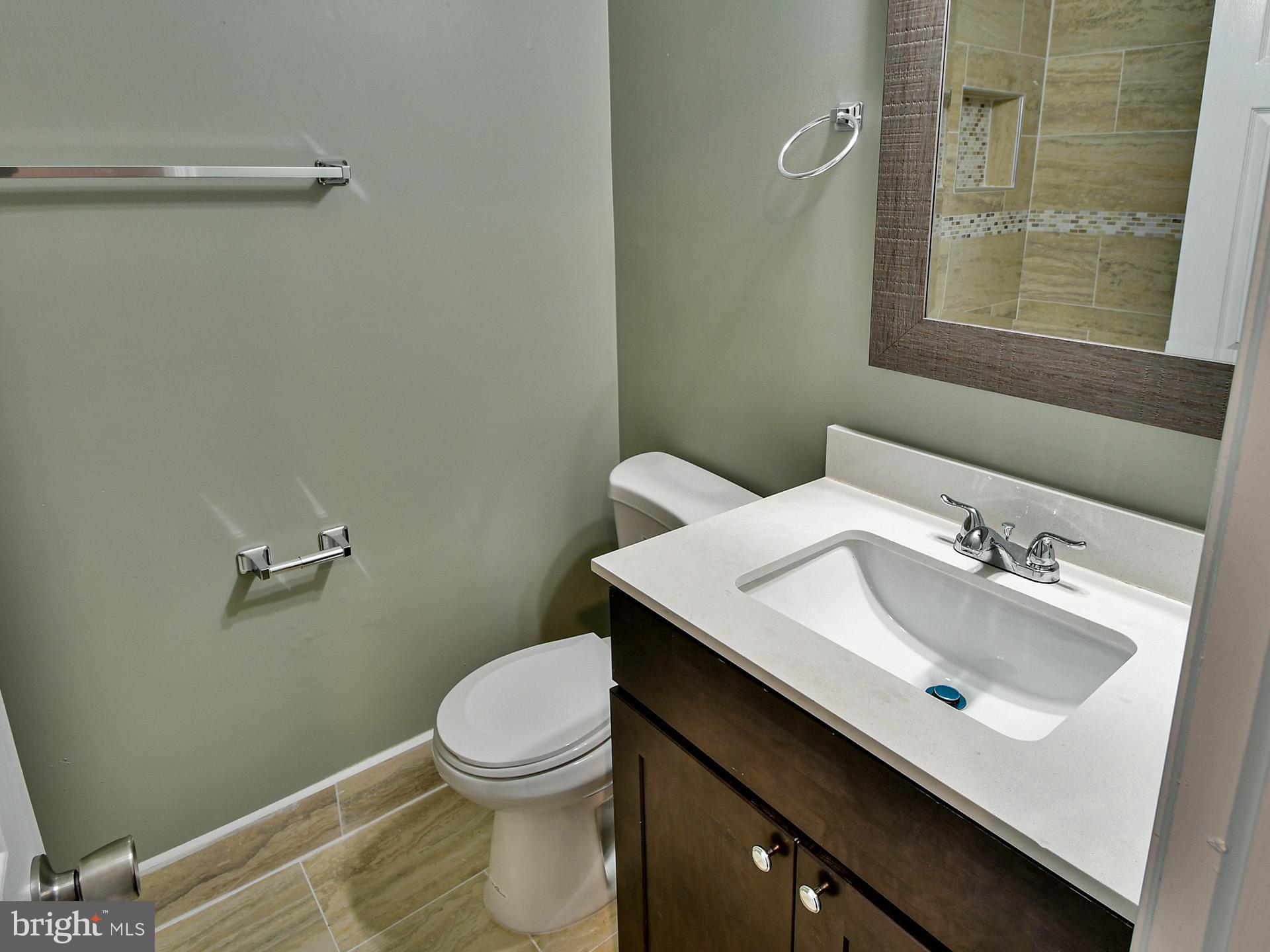 3511 Castle Way, Unit 312 Silver Spring, MD 20904 - Photo 22 of 34 a bathroom with a sink and a toilet