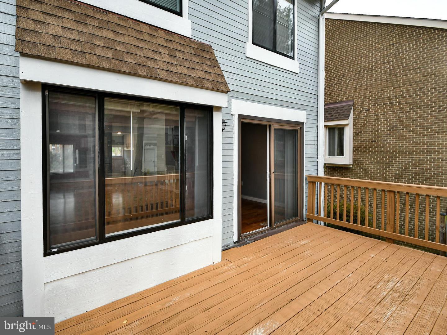 3511 Castle Way, Unit 312 Silver Spring, MD 20904 - Photo 28 of 34 a view of a brick house with a large window