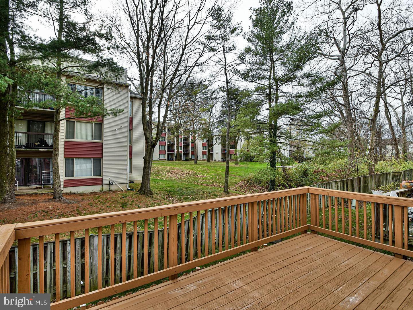 3511 Castle Way, Unit 312 Silver Spring, MD 20904 - Photo 30 of 34 a view of a wooden roof deck