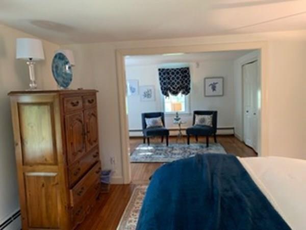 603 Hatherly Road Scituate, MA 02066 - Photo 15 of 19 a living room with furniture and a table