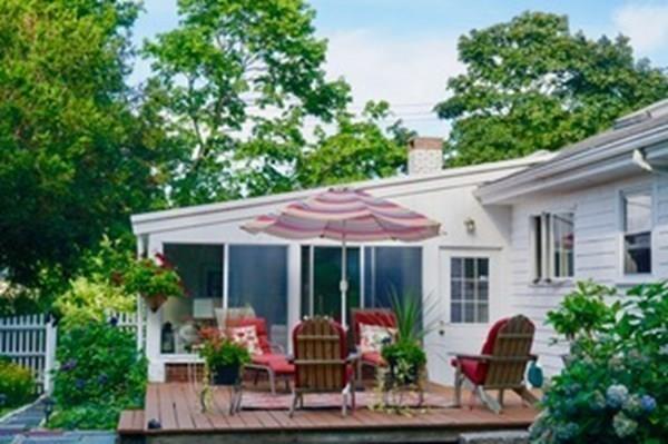 603 Hatherly Road Scituate, MA 02066 - Photo 16 of 19 a front view of house with yard and outdoor seating