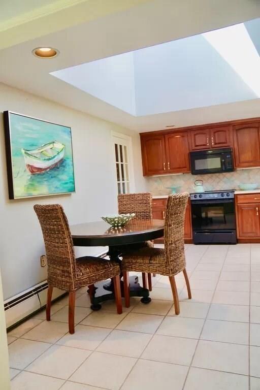603 Hatherly Road Scituate, MA 02066 - Photo 5 of 19 a living room with furniture and a kitchen view