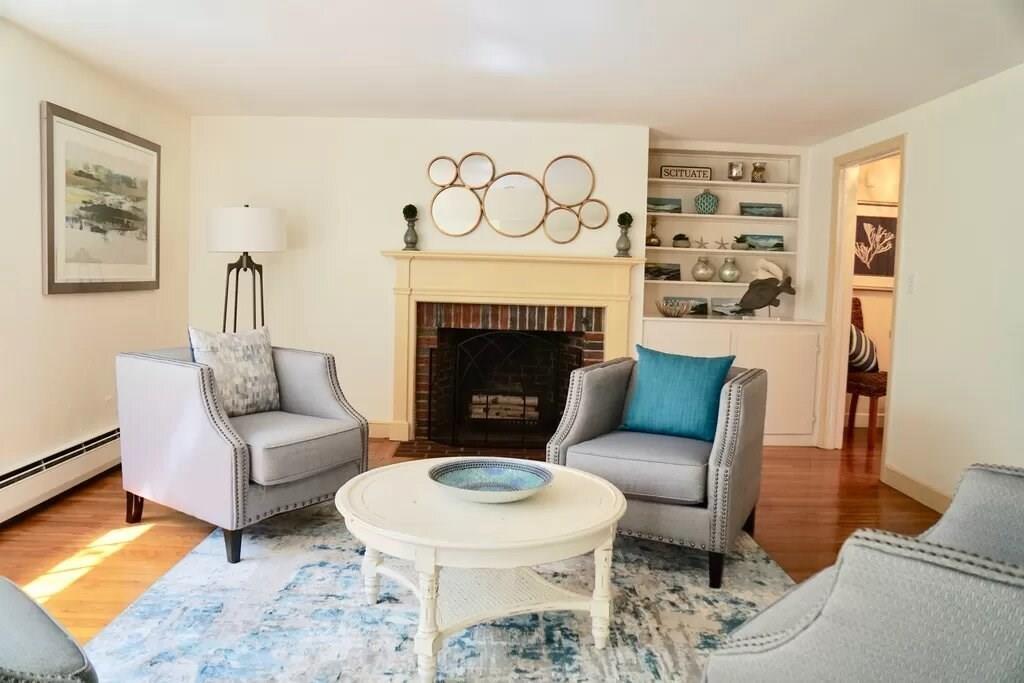 603 Hatherly Road Scituate, MA 02066 - Photo 7 of 19 a living room with furniture and a fireplace