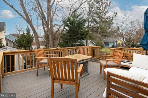a view of a patio with wooden floor