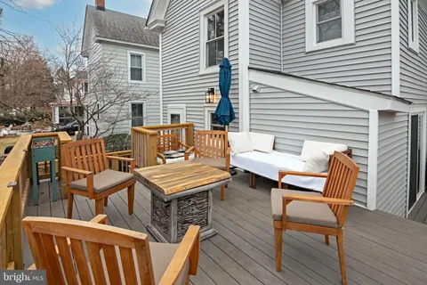a blue bench sitting in front of a house