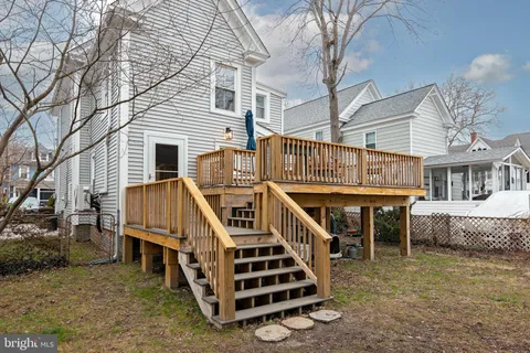 a view of a house with wooden deck