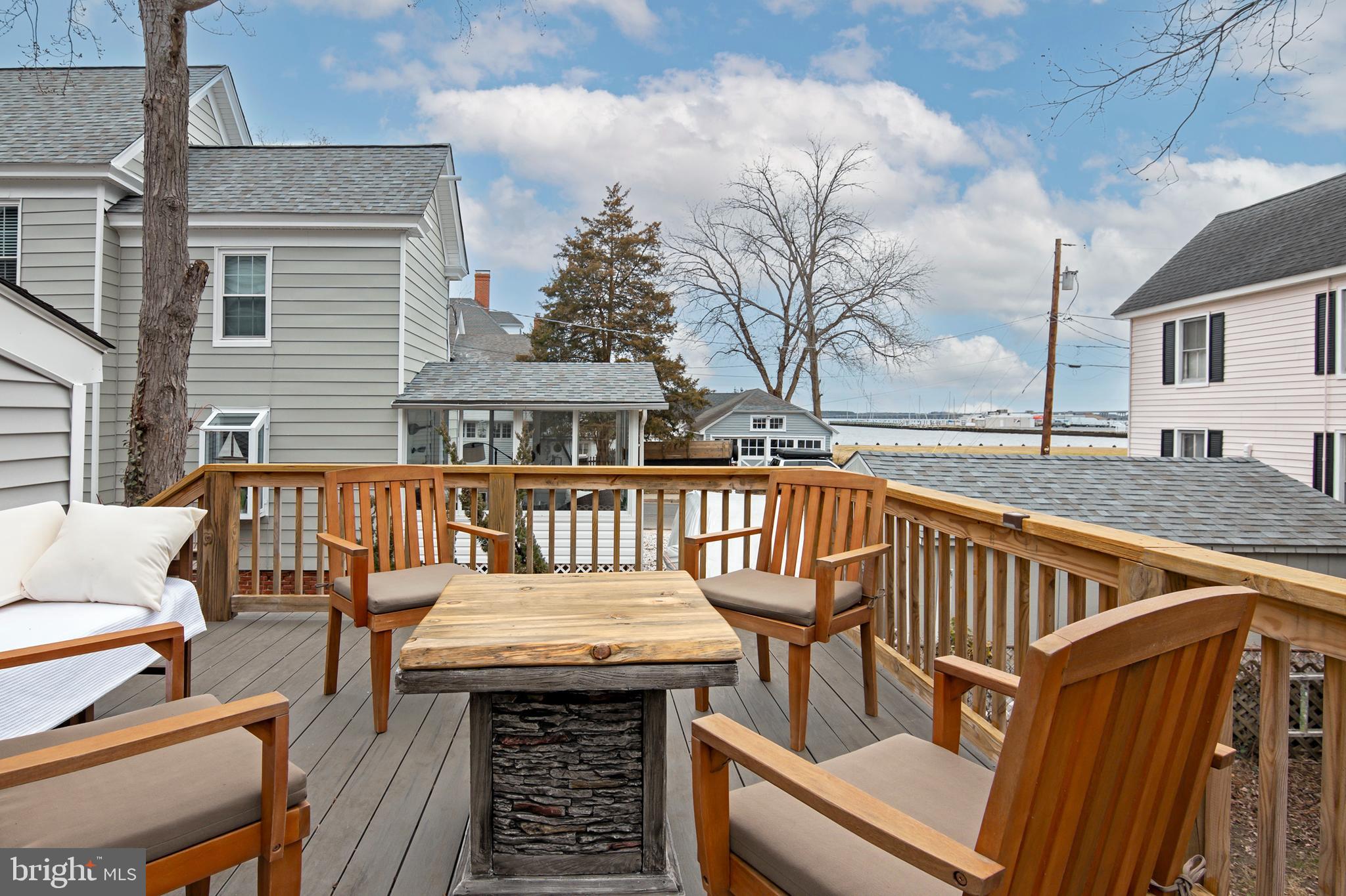 102 Choptank Avenue Cambridge, MD 21613 - Photo 3 of 23 a balcony with wooden floor and outdoor seating