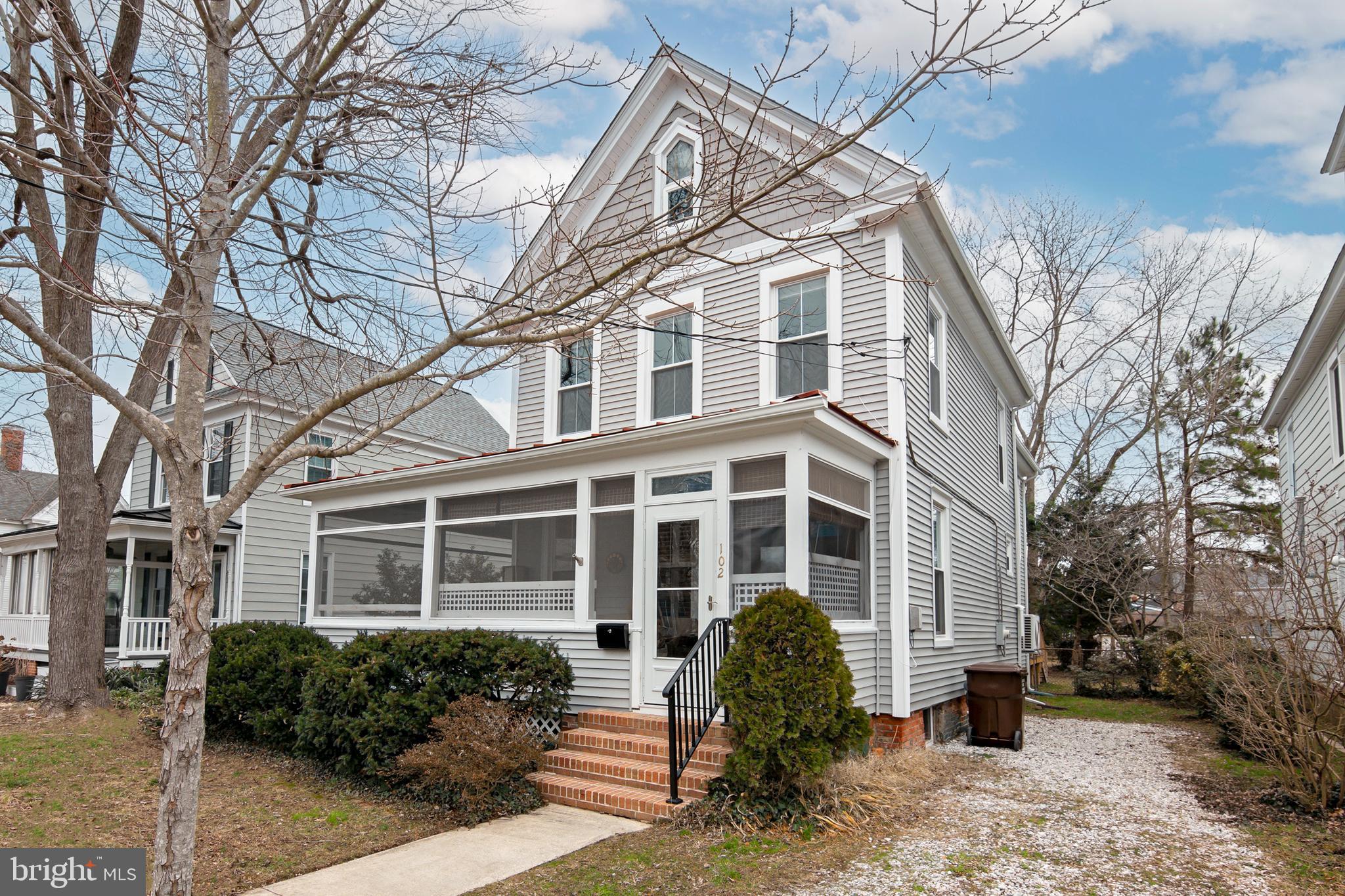 102 Choptank Avenue Cambridge, MD 21613 - Photo 4 of 23 a front view of a house with a yard