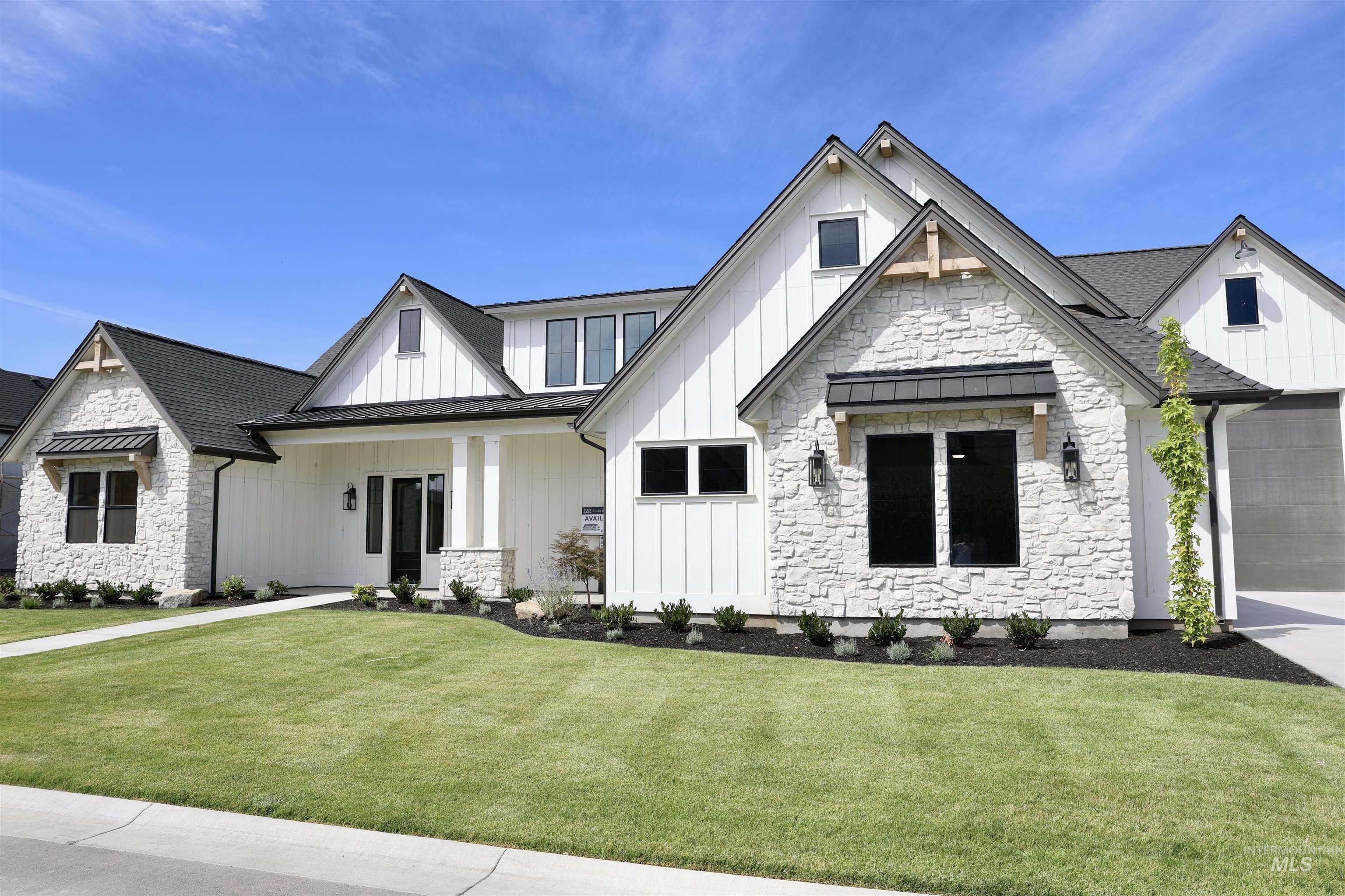 482 Century Avenue Middleton, ID 83644 - Photo 2 of 41 View of front of property with a standing seam roof, board and batten siding, stone siding, a metal roof, and a front lawn