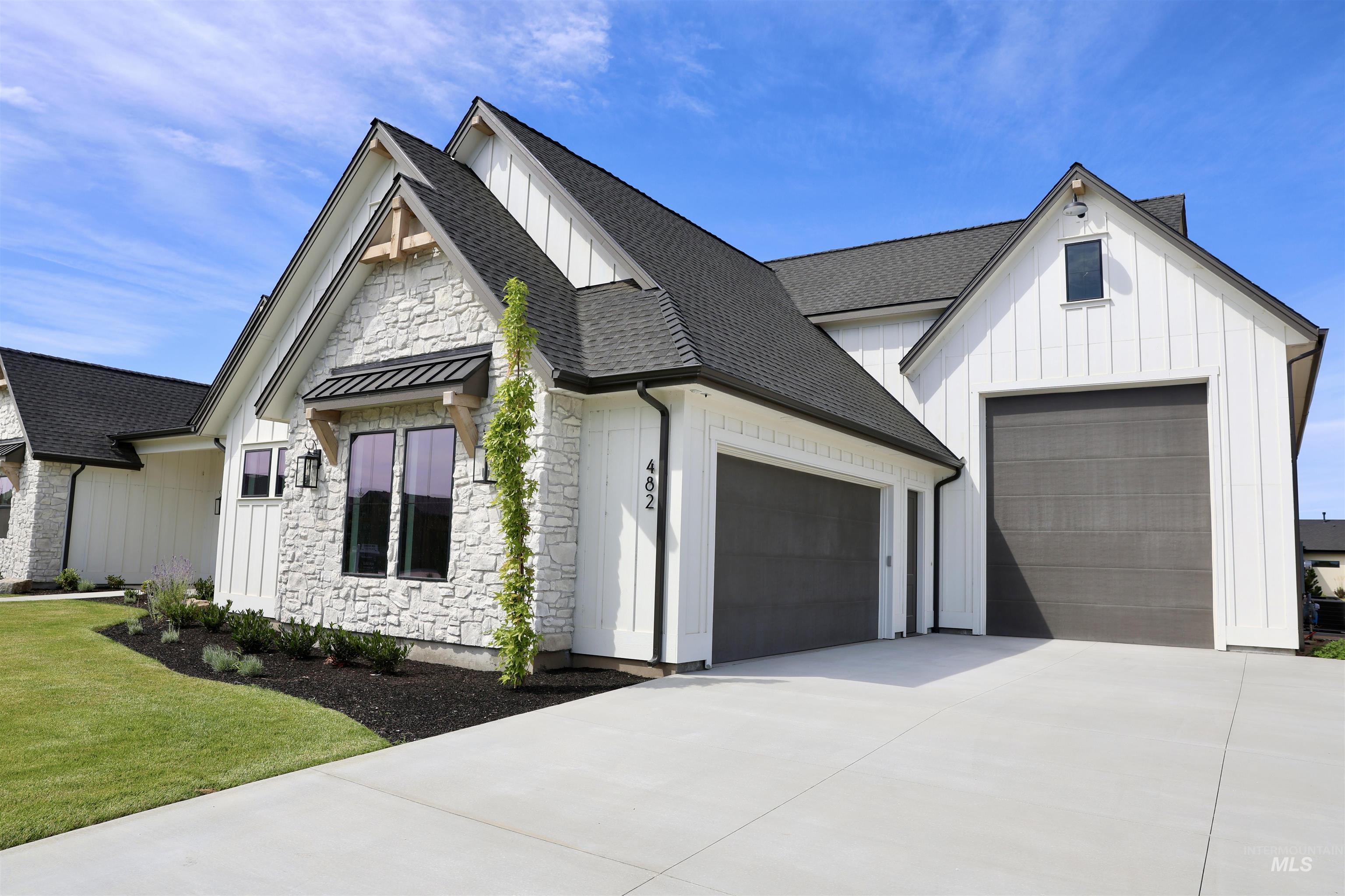 482 Century Avenue Middleton, ID 83644 - Photo 3 of 41 Modern farmhouse style home featuring board and batten siding, stone siding, a shingled roof, and concrete driveway