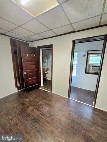 a white bath tub sitting next to a white toilet