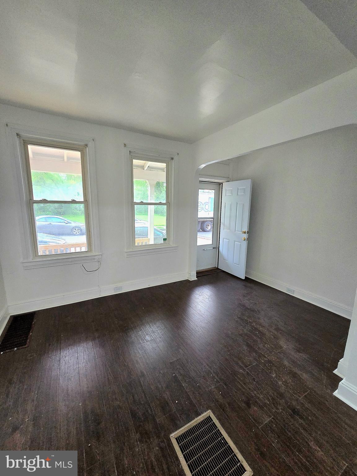 569 Smith Street York, PA 17404 - Photo 3 of 16 an empty room with wooden floor and windows