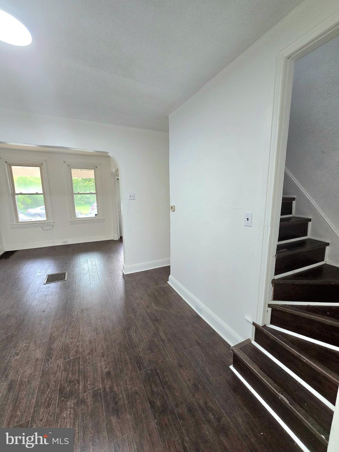 569 Smith Street York, PA 17404 - Photo 4 of 16 an empty room with wooden floor and windows