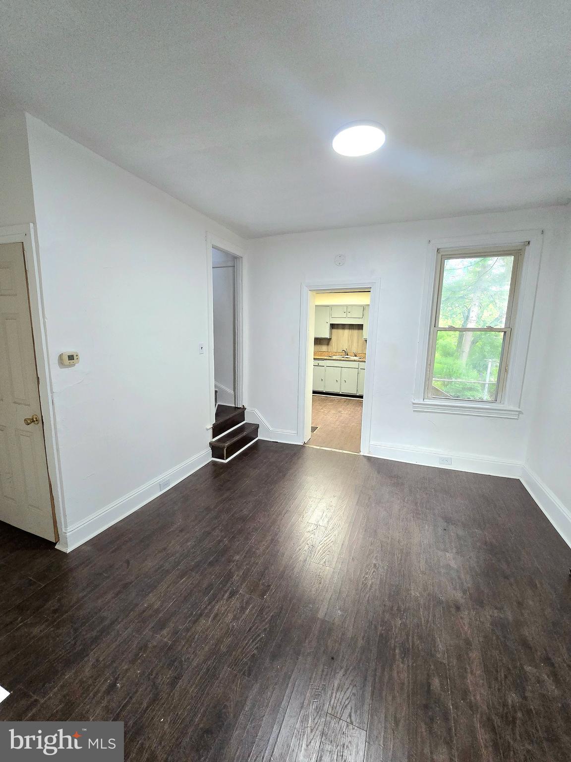 569 Smith Street York, PA 17404 - Photo 7 of 16 an empty room with wooden floor and windows