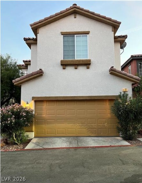 8937 Caledon Ridge Court Las Vegas, NV 89149 - Photo 1 of 2 A well-maintained stucco facade with a prominent garage offers immediate curb appeal.