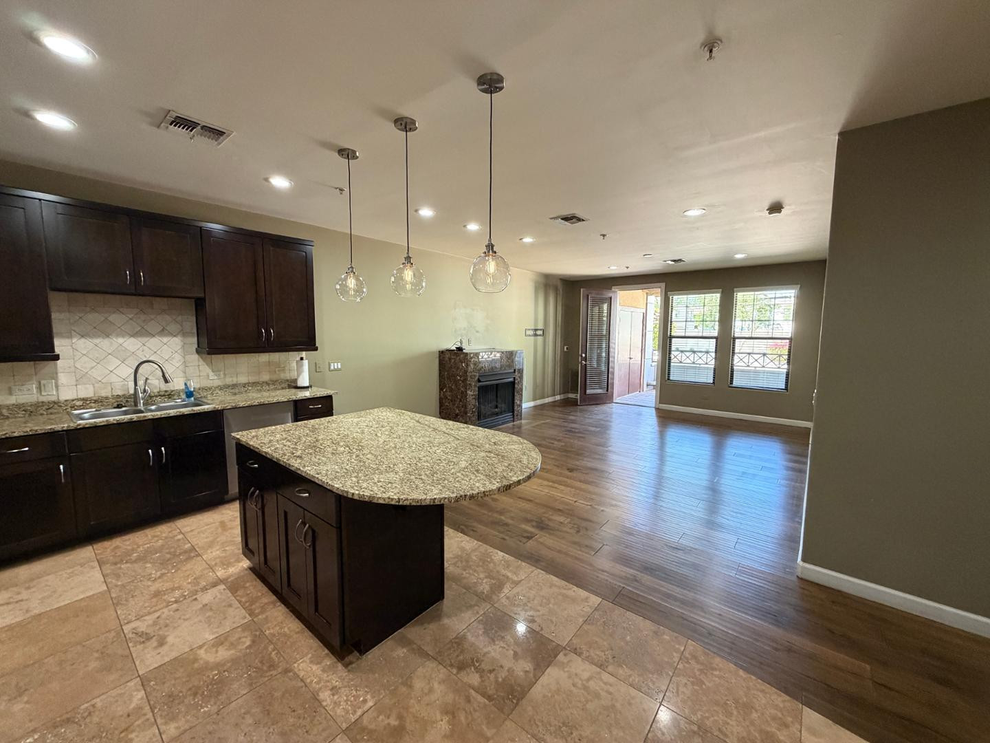 7291 North Scottsdale Road, Unit 1001 Paradise Valley, AZ 85253 - Photo 1 of 34 a kitchen with a sink a counter top space and stainless steel appliances