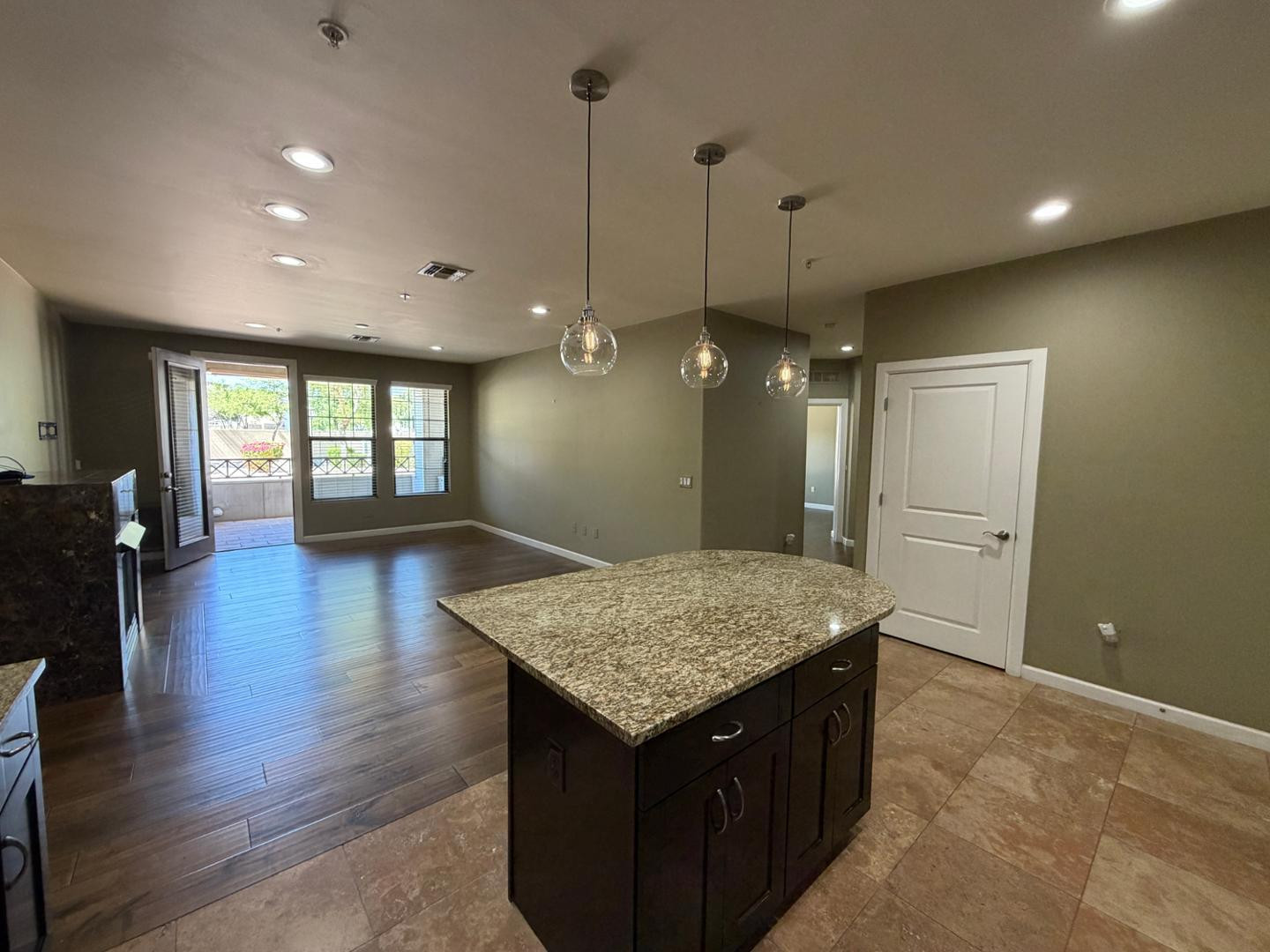 7291 North Scottsdale Road, Unit 1001 Paradise Valley, AZ 85253 - Photo 2 of 34 a kitchen that has a lot of cabinets and wooden floor