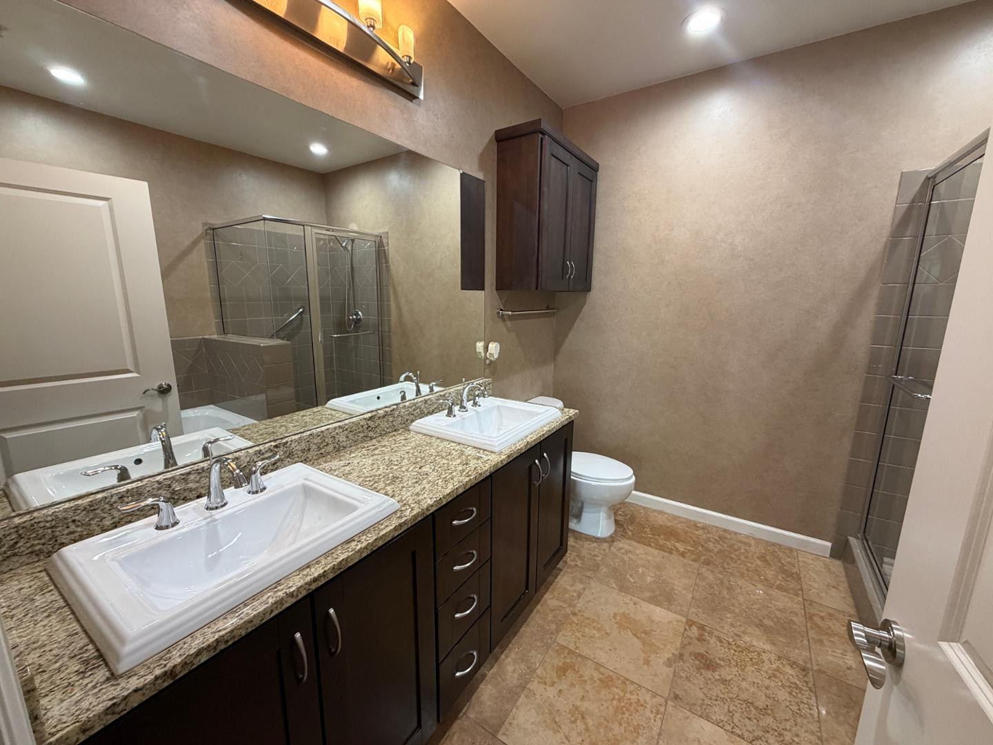 7291 North Scottsdale Road, Unit 1001 Paradise Valley, AZ 85253 - Photo 23 of 34 a bathroom with a granite countertop sink a toilet and a mirror