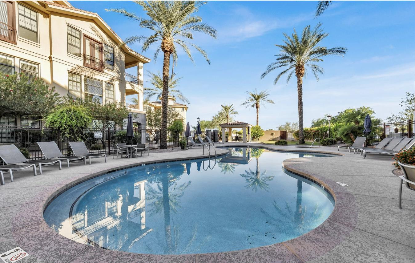 7291 North Scottsdale Road, Unit 1001 Paradise Valley, AZ 85253 - Photo 31 of 34 a view of a swimming pool with outdoor seating