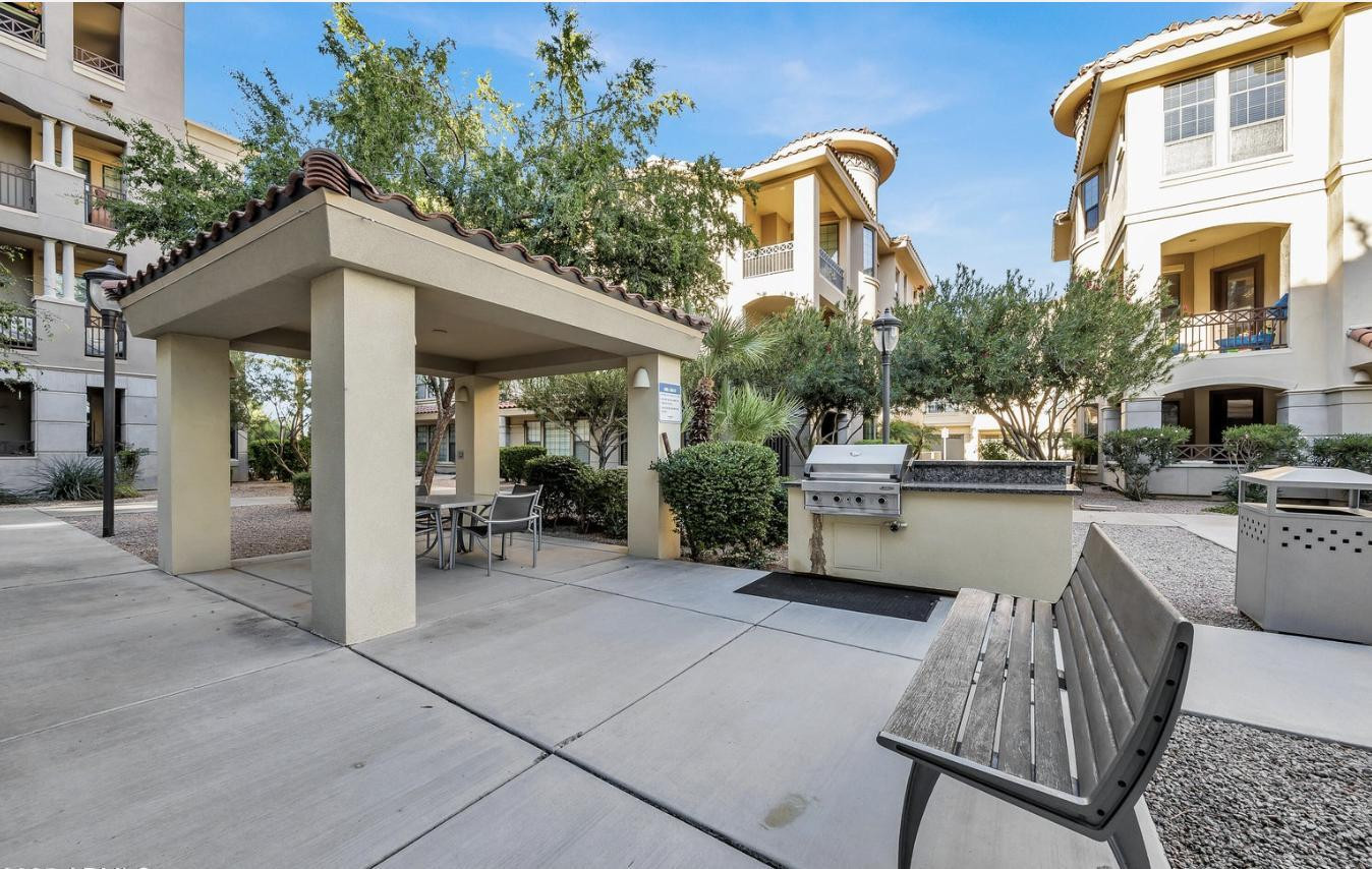 7291 North Scottsdale Road, Unit 1001 Paradise Valley, AZ 85253 - Photo 33 of 34 a view of a patio with couches table and chairs and potted plants