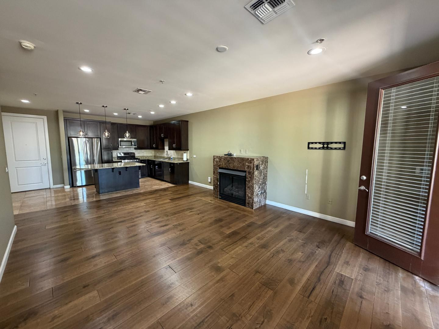 7291 North Scottsdale Road, Unit 1001 Paradise Valley, AZ 85253 - Photo 6 of 34 a view of kitchen with furniture and wooden floor