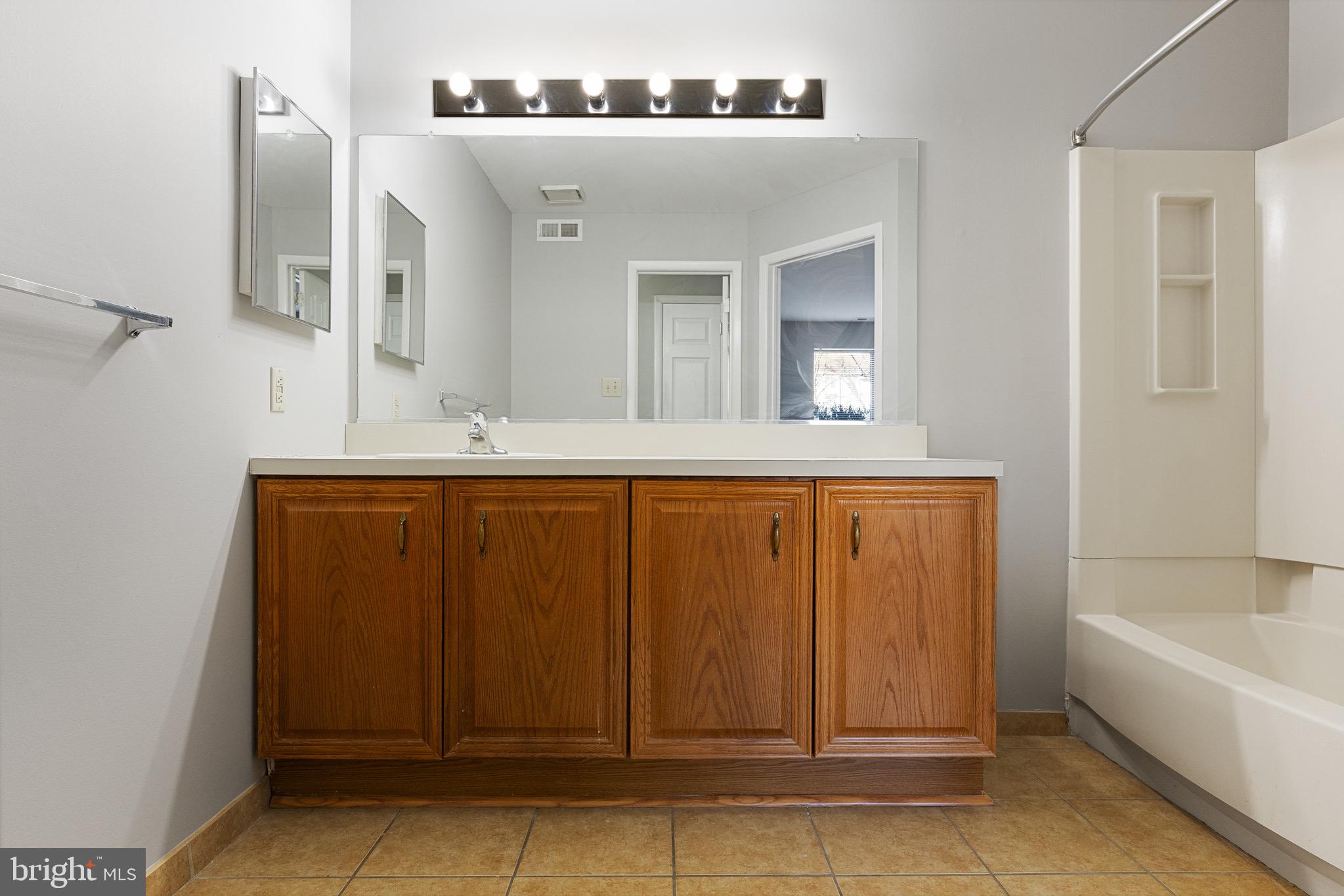 5306 A Aberdeen Drive Mount Laurel, NJ 08054 - Photo 13 of 18 a bathroom with a sink and a bathtub