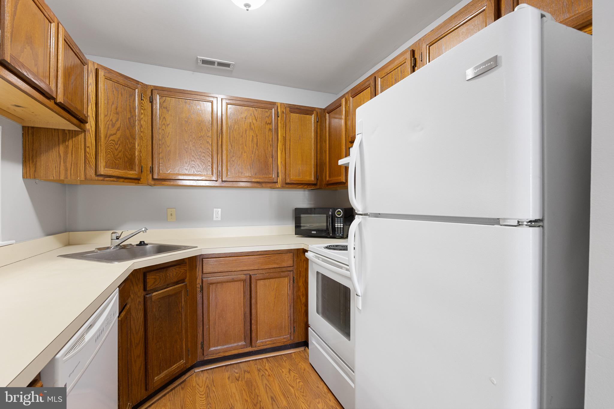 5306 A Aberdeen Drive Mount Laurel, NJ 08054 - Photo 7 of 18 a utility room with cabinets washer and dryer